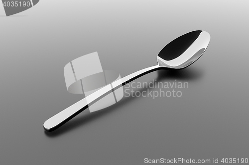 Image of Silver spoon on a table