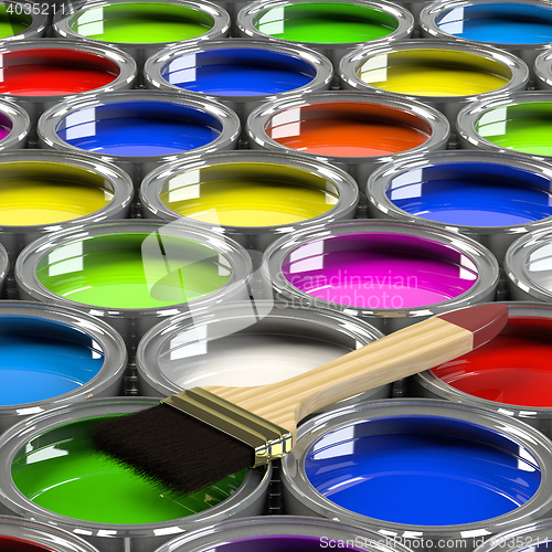 Image of Multiple open paint cans.