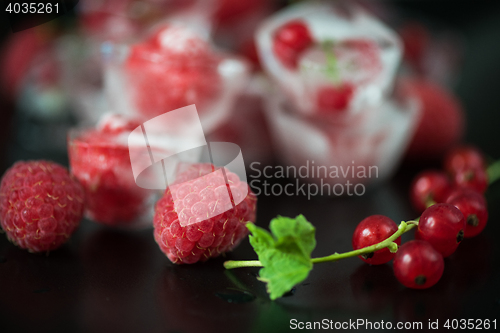 Image of Frozen berries on wooden table