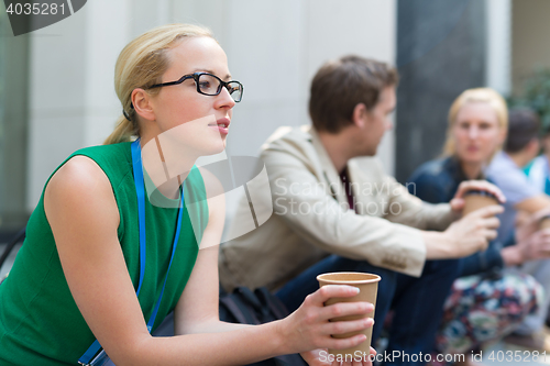 Image of Cheerful colleagues meeting for coffee break.