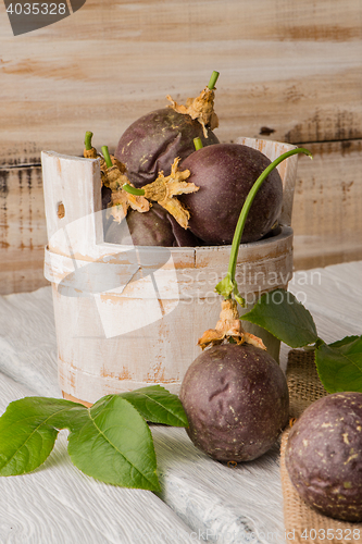 Image of Passion fruits s on a wooden table