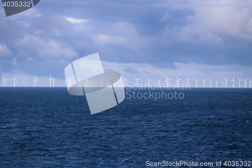 Image of Windmills in a row in the Baltic sea