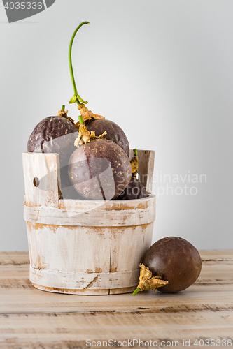 Image of Passion fruits s on a wooden table