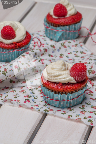 Image of Red cupcakes with cream cheese frosting