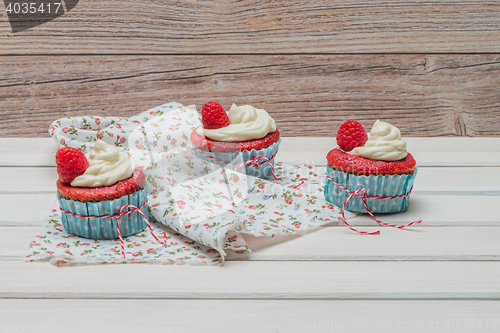 Image of Red cupcakes with cream cheese frosting