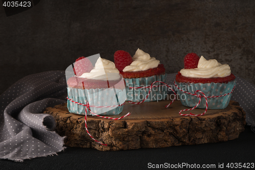 Image of Red cupcakes with cream cheese frosting