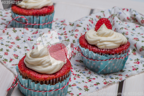 Image of Red cupcakes with cream cheese frosting