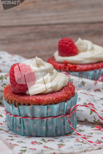 Image of Red cupcakes with cream cheese frosting