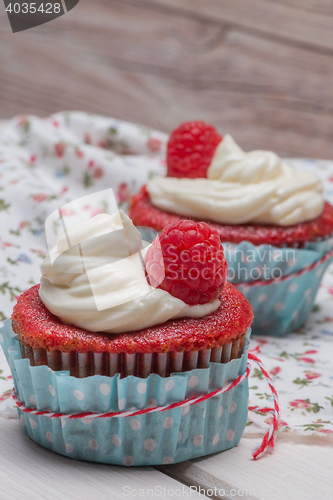 Image of Red cupcakes with cream cheese frosting
