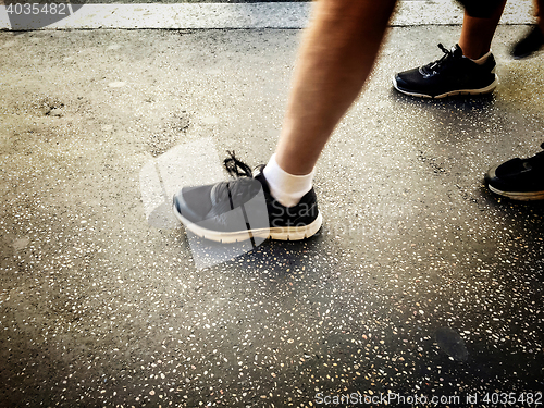 Image of People walking on a walkside