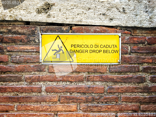 Image of Danger sign on a brick wall