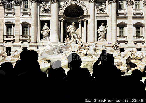 Image of Trevi fountain and tourists shooting