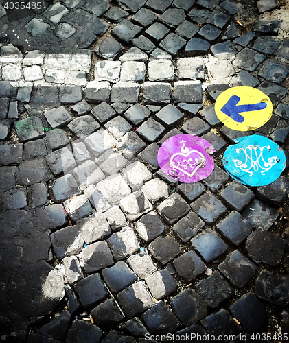 Image of Cobblstone street with colored indications