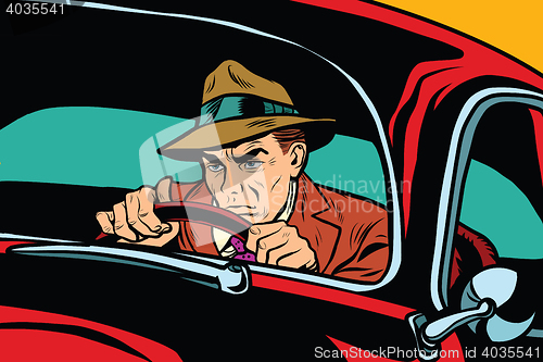 Image of Serious retro man driving a car