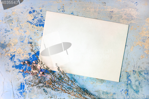 Image of Blank Card And Dried Flowers On The Blue Wooden Background