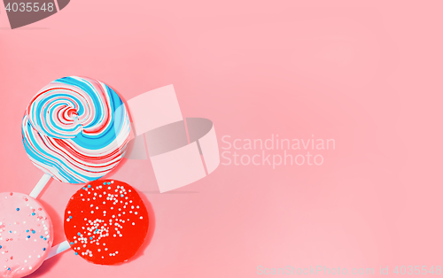 Image of Vintage Pink Background With Colored Candy