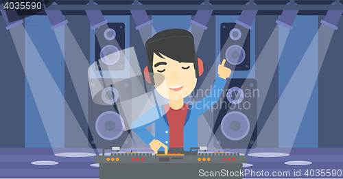 Image of Smiling DJ mixing music on turntables.