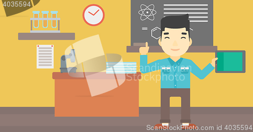 Image of Male student using tablet computer in classroom.