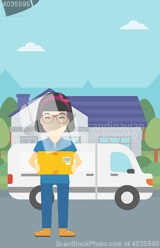 Image of Delivery woman carrying cardboard boxes.