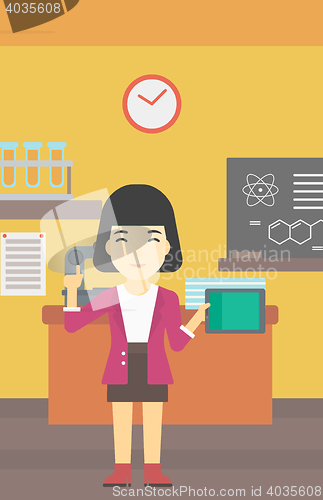Image of Female student using tablet computer in classroom.
