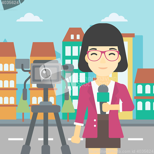 Image of TV reporter with microphone and camera.