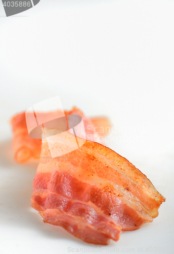 Image of cooked slice of bacon isolated on white