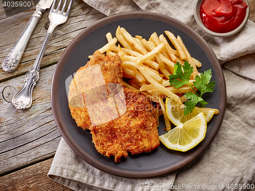 Image of schnitzel and fried potatoes