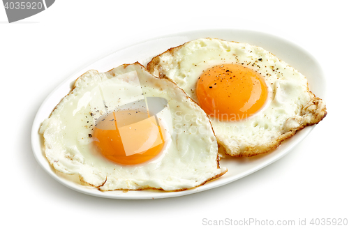 Image of fried eggs on white background