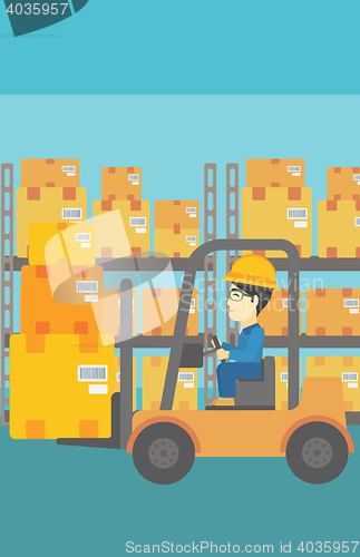 Image of Warehouse worker moving load by forklift truck.