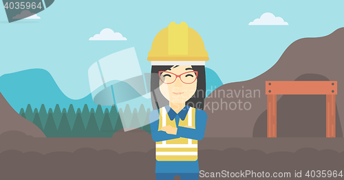 Image of Miner with mining equipment on background.