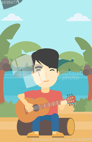 Image of Musician playing acoustic guitar.