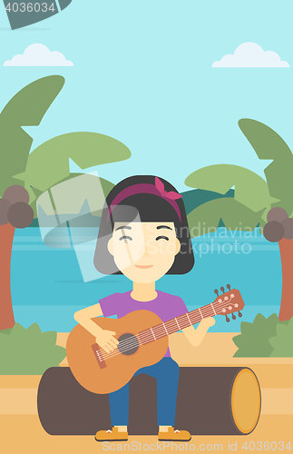 Image of Musician playing acoustic guitar.