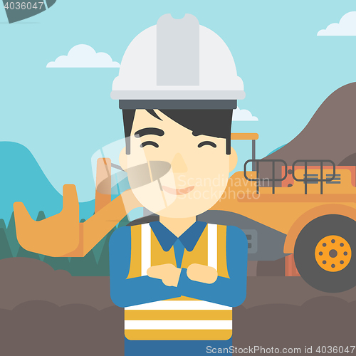 Image of Miner with mining equipment on background.