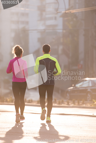 Image of young  couple jogging