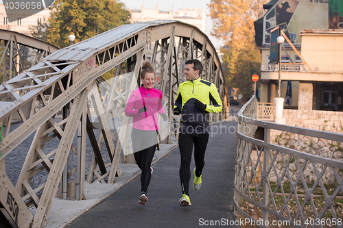 Image of young  couple jogging