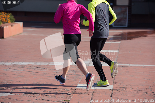 Image of young  couple jogging