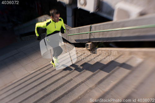 Image of man jogging on steps