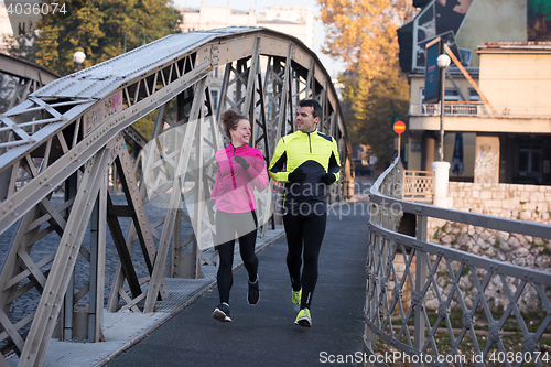 Image of young  couple jogging