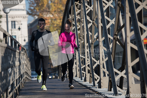 Image of young  couple jogging