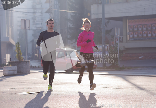 Image of young  couple jogging