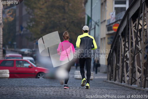 Image of young  couple jogging