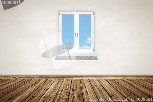 Image of empty wooden room with a window