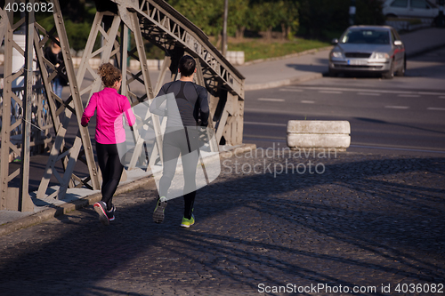 Image of young  couple jogging
