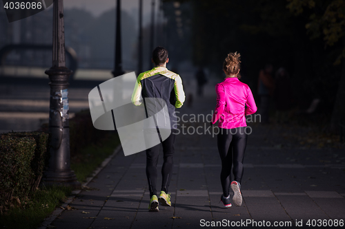 Image of young  couple jogging