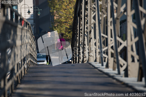 Image of young  couple jogging