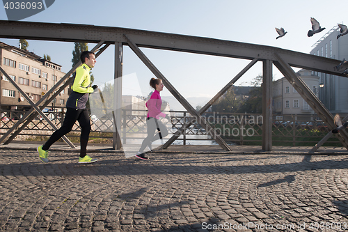 Image of young  couple jogging