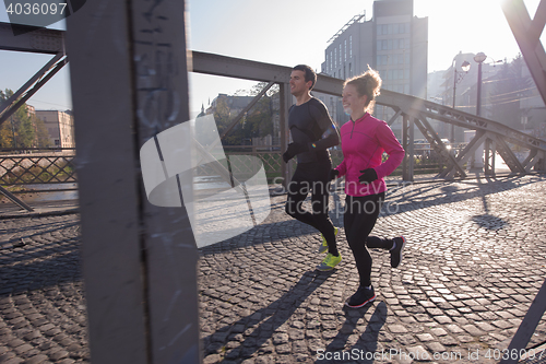 Image of young  couple jogging