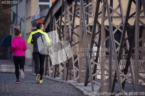 Image of young  couple jogging