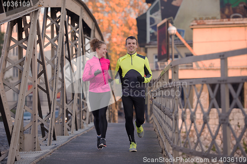 Image of young  couple jogging