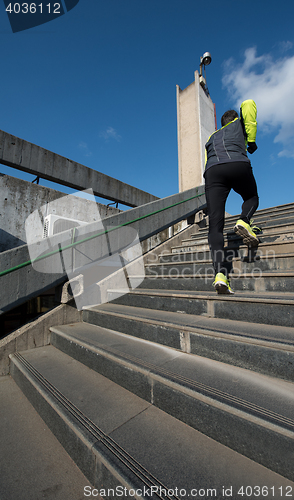 Image of man jogging on steps